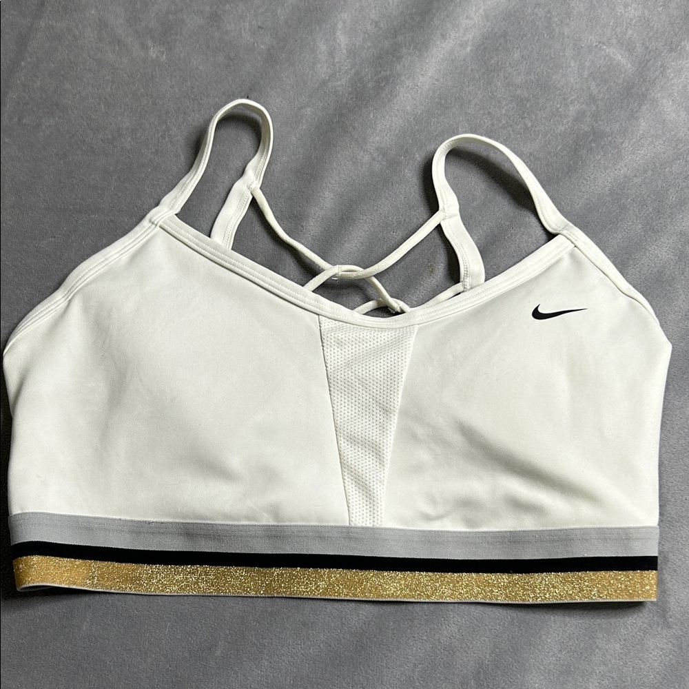Nike Glam Dunk Indy bra features a distinctive metallic gold glitter band.
